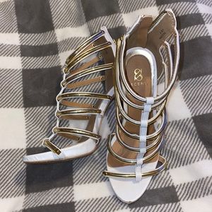 White and gold gladiator heels
